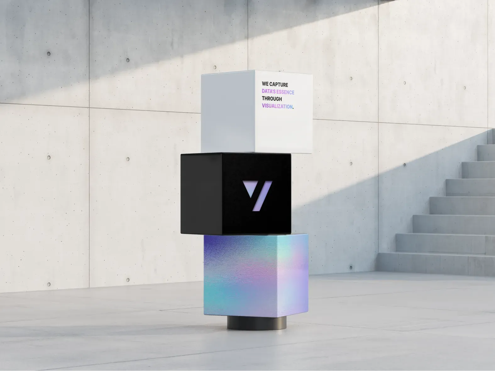 Three stacked cubes in a sunlit concrete space: a white cube with "We capture data's essence through visualization", a black cube with the mark and an iridescent cube